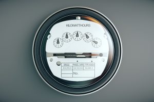 Typical residential analog electric meter with transparent plactic case showing household consumption in kilowatt hours. Electric power usage.